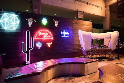 Guests could grab a beverage from the Neon Saloon and a treat from a custom churro station.