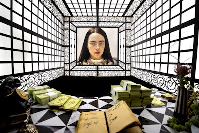 The “salon” was adorned with taxidermied creatures, mementos from Bella's journey, and portraits from the film.