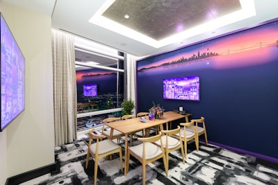 A strategically designed entrance with an LED archway welcomed guests, and subtle touches in Roku's brand colors were featured throughout the meeting spaces, including the digital screen saver backdrop.