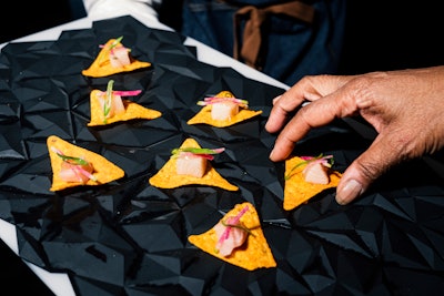 Gourmet Doritos, anyone? During a celebration for the launch of the chip brand's limited-edition nacho cheese-flavored spirit, created in partnership with Empirical, guests could enjoy cocktail party bites that all incorporated Doritos chips and flavors (including these yellowtail crudo bites). Pinch Food Design handled the event's catering. See more: This Stylish Launch Party Used Doritos as Decor (Yes, Really)