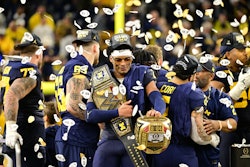 Designed by Raven Lake Studio and in partnership with Arts & Letters Creative Co., the ring is about one foot in height and width and is worn on three fingers. The ring appeared at Playoff Fan Central and within ESPN programming leading up to the championship game. Players from Michigan had a chance to wear the ring on the field immediately following their win.