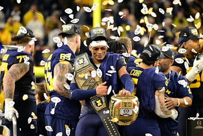 Designed by Raven Lake Studio and in partnership with Arts & Letters Creative Co., the ring is about one foot in height and width and is worn on three fingers. The ring appeared at Playoff Fan Central and within ESPN programming leading up to the championship game. Players from Michigan had a chance to wear the ring on the field immediately following their win.