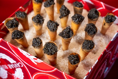 Last year's City Harvest signature tasting event, BID, invited guests to a drive-in to benefit New Yorkers in need. Bites from the night included these caviar-filled cones. Great Performances handled catering for the events. See more: How City Harvest’s 2023 Drive-In-Themed Tasting Event Brought Movie Magic to Life