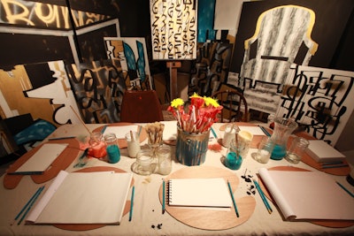 The 2013 edition of DIFFA's Dining by Design also featured a fun tablescape from Agati Furniture/Desks that was modeled after an artist's studio. A bucket of paintbrushes served as centerpieces, and sketchpads took the place of plates. See more: 24 Steal-Worthy Decor Ideas From Diffa's Dining by Design in Chicago
