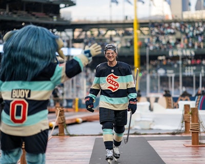 The Seattle Kraken's new mascot, Buoy, kept fans entertained during the NHL Winter Classic.