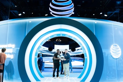 The tech-enhanced helmet features an augmented reality lens fastened to the front, which coaches can send play calls to via a custom tablet application. Gallaudet quarterbacks Brandon Washington and Trevin Adams (pictured) were on hand to discuss the AT&T 5G helmet. This was AT&T’s 10th year sponsoring the College Football Playoff.