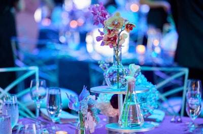 In Chicago, the Museum of Science and Industry celebrated its 90th anniversary at its annual Columbian Ball in September 2023. In a venue-appropriate touch, centerpieces featured scientific props like glass beakers, which held flowers in pale blue, fuchsia, and purple hues. TM Production Services handled event and audiovisual design, and 1440 Event Design assisted with decor.