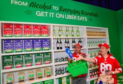 The immersive market experience allowed guests to walk through a Super Bowl-themed grocery store and use the Uber Eats app to place a (free) order from Uber Eats. They could then pick up their bag at the end of the activation.