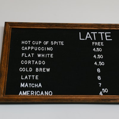The idea was inspired by the show. In season 10, Larry opens a competing cafe next door to Mocha Joe’s in response to a long-running argument. The cafe featured hot cups of spite, extra-dry scones, no wobbly tables, coat stands, and no restrooms.