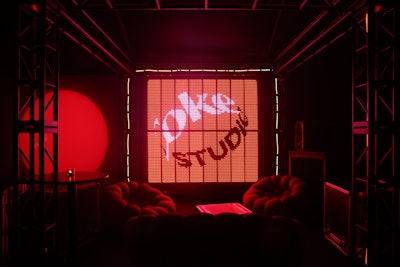 The entrance tent, sponsored by Coke Studio, boasted modern red furniture, LED light walls, and rotating graphics.