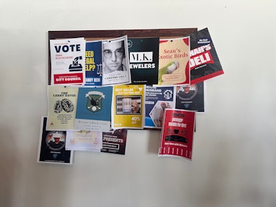 Like a typical coffee shop, a bulletin board was plastered with flyers including references from the show.