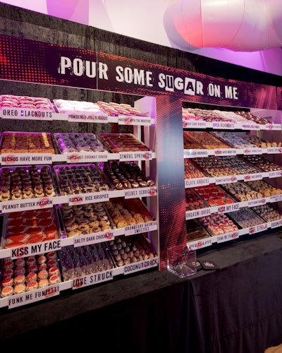 An over-the-top dessert bar—dubbed the “Pour Some Sugar on Me” corner, a nod to Def Leppard’s iconic song—boasted an array of sinful bites. Each one playfully nodded to the night’s theme, such as the “Love Struck” lightning bolt-shaped cookies and the suggestive “Funk Me Funfetti” cupcakes and chocolate-covered “Orgasm Oreos.”