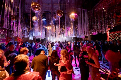 Love rocks—and so does dancing under a sea of disco balls and glittering streamers.