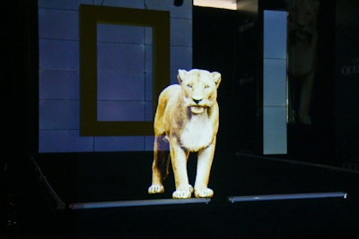 Act I featured a hologram of the lioness from the “Crater Queens” episode, and showcased a model wearing a custom tan crushed velvet design inspired by the color and fur of a lioness by Theophilio, the Brooklyn-based fashion brand from Jamaican-American designer Edvin Thompson.