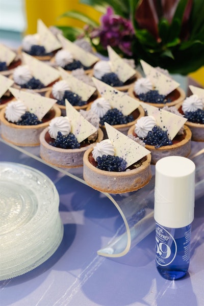 A dessert table featured lavender caviar treats and brigadeiros.
