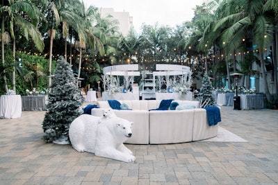 Guests were welcomed to the event with cocktails on an outdoor patio that was transformed into a snow-dusted winter escape. Sterling Engagements created lounges that integrated cozy furniture groupings, oversize Bazic Products, and even some polar bears.