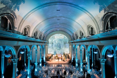 'Because of the nature of Vibiana and the way the venue lays out, projection was the way to go,' said Rembac. 'We felt it would yield a much bigger impact than a ceiling install or anything too complicated on the tables.' Sterling Engagements worked closely with the venue's in-house AV team to produce 'scenes' that would subtly shift throughout the night: For arrivals, it depicted a snowlike journey to the destination; for the program, it was a forest that made guests feel like they were staring out a window at a perfect winter setting; and for the party, the projections morphed into a fun, festive, and celebratory atmosphere. 'We modified the overhead and front perspective within each look, and as the evening progressed, so did our surroundings—which was really fun,' she noted.