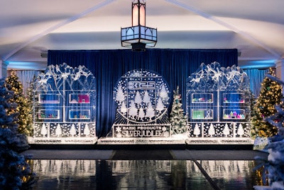 As guests entered the indoor reception—which was designed to evoke a snowcapped sparking forest—they discovered a 20-foot ice wall fabricated by Ice Bulb. It included a branded ice snow globe in the middle, and was flanked by ice walls with actual Bazic products frozen inside. 'They were so fun and playful, and the perfect breakup as guests transitioned to the main space,' said Rembac.