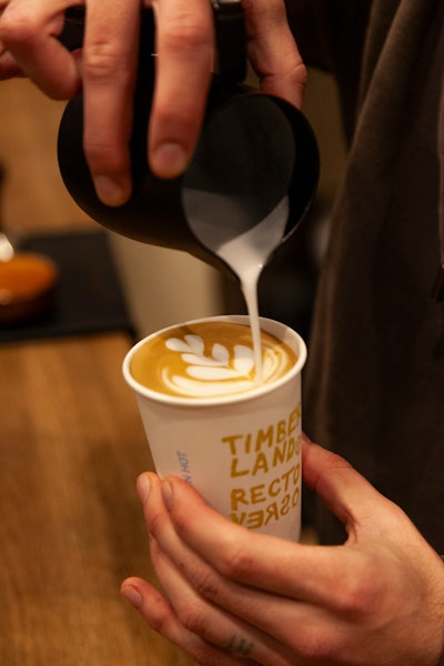 Guests enjoyed coffee in co-branded cups and complimentary biscoitos.