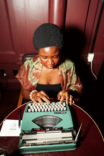Nunyala Sogbo of Ars Poetica—a woman-owned creative agency that provides bespoke experiences merging poetry, art, and entertainment—wrote custom poems for guests.