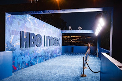 The HBO | Max Emmys party featured a vibrant blue carpet with custom-made navy bouclé letters, all set against an eclectic pattern that continued throughout the party space. 'My philosophy for high-end experiential design is similar to the way I look at interiors, focusing on a constant play between color, texture, pattern, and light while finding holistic ways to re-imagine any given space,” said event producer Kate Mazzuca. 'We chose a rich but muted palette of deep navy, union blue, and a color I've dubbed 'French sapphire,' with pops of warm, oatmeal beiges, and punctuated by olive green, deep rust, and a soft peachy cinnamon.'