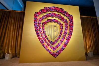 'We wanted to have a statement piece to welcome the guests as they arrived at the party,' said Wang. 'We took the iconic WB shield and gave it an Oscar-worthy look by creating a moment in gold with florals in various shades of purples and pinks to give nods to The Color Purple and Barbie.'