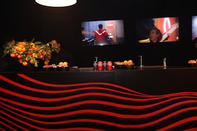 Universal Music Group's Grammys after-party also leaned into curved shapes, adding wavy red stripes to a bold black bar.