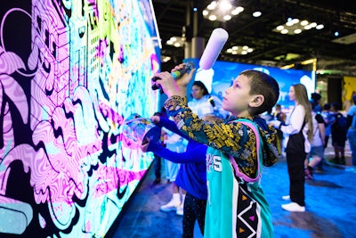 Also at NBA Crossover was the All-Star mural, sponsored by AT&T, which allowed fans to interact in two ways: Selfie Mode or World View Mode. In Selfie Mode, a blank mural background set the stage for fans' creation; when they switched to World View Mode, the mural came to life via AR, and fans could digitally 'paint it' using the paint bucket tool. Once completed, they could switch back to Selfie Mode to admire the collaborative masterpiece.