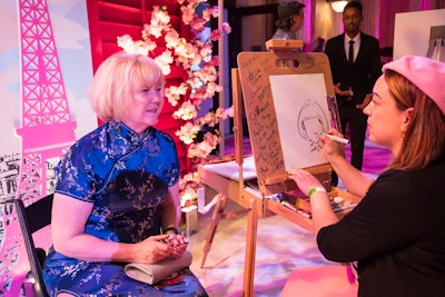 In the Paris room, a Parisian 'street artist' created caricatures for guests.