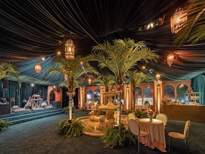 WME kicked off Oscars weekend at the Hearst Estate in Beverly Hills. A tent with custom scenic walls, arched windows matching the home’s exterior, and hanging light fixtures was built around the patio, expanding the indoor party space and adding some interest to the ceiling decor. The event was produced in house by the corporate events team at WME parent company Endeavor.