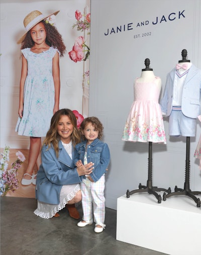 Entrepreneur and actress Ashley Tisdale (pictured here with her daughter, Jupiter) served as the host of the party.