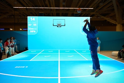 Once inside, fans had the chance to dribble and shoot basketballs on an immersive, motion-tracking LED court.