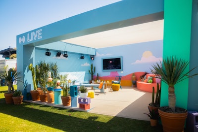YouTube's lounge also featured covered seating vignettes for guests to relax and cool down; there were also lawn games and a pink-fringe popsicle cart.