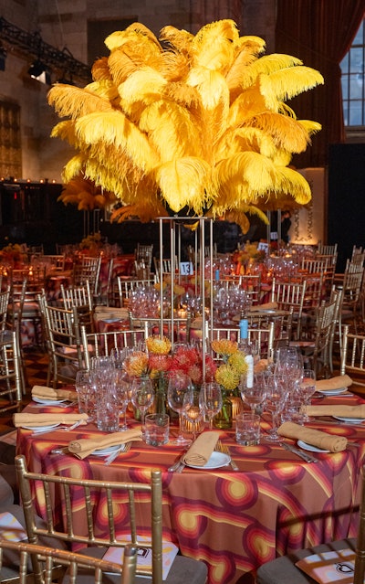 The room was anchored with tall mustard and gold ostrich feathers.