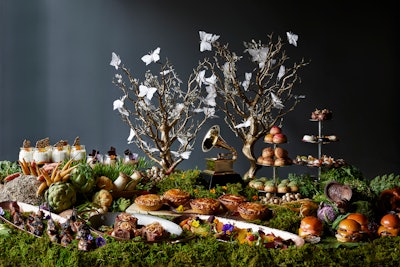 For the Grammy Awards after-party in 2017, Patina Catering offered fanciful takes on A Midsummer Night’s Dream at four food stations, which drew inspiration from the enchanted forests and settings portrayed in the famous Shakespeare work. A “Forest Foraged” station drew ingredients and inspiration from forests, while the 'Fairy’s Land” station (pictured) offered desserts presented in a whimsical, organic setting.