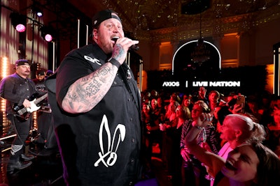 The event featured a surprise performance by country music singer Jelly Roll (pictured). The gathering also brought together media and entertainment luminaries for a night of music and networking. Guests included Axios co-founders Jim VandeHei, Mike Allen, and Roy Schwartz; Live Nation Entertainment President and CFO Joe Berchtold; actress and singer Lynda Carter; and journalist and podcast producer Kara Swisher.