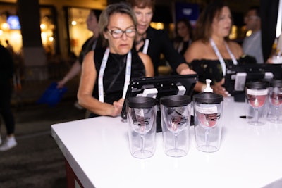 Cadillac showcased a variety of vehicles and invited guests to share their contact information in exchange for branded wine cups.
