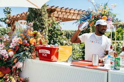 Sponsor Smirnoff ICE hosted lawn games and helped guests cool off with drinks served from a floral-covered bar. Another sponsor, Lumify, hosted the Lumify Eyes Bejeweled Bar, which let guests elevate their festival makeup with vibrant jewel products.
