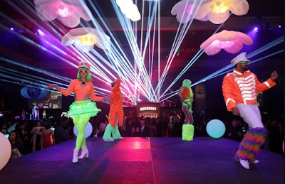 For this year's Grammys, The Recording Academy’s official after-party—which took place at the Los Angeles Convention Center—treated its 5,000 guests to an eclectic, music festival-themed celebration. Producers tapped into a neon theme with light-up trees, hanging floral light fixtures, and laser lighting effects. See more: Grammys 2024: 40+ Trend-Setting Event Ideas From the Week's Star-Packed Parties