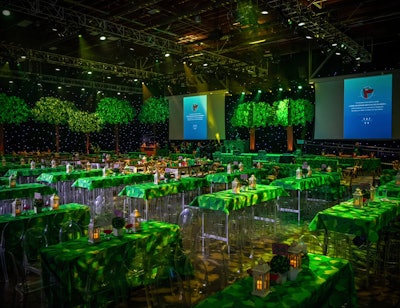 The Luskin Orthopaedic Institute for Children Gala was held in June 2023 at Universal Studios Hollywood. With the design, producer Billy Butchkavitz wanted to evoke the idea of a magical forest, inspired by the studio's Wizarding World of Harry Potter section. In addition to 22-foot-high theatrical scrim trees, a custom leaf-patterned fabric was used on the furniture and tablecloths. Moody lighting from Images by Lighting completed the leaf-filled look.