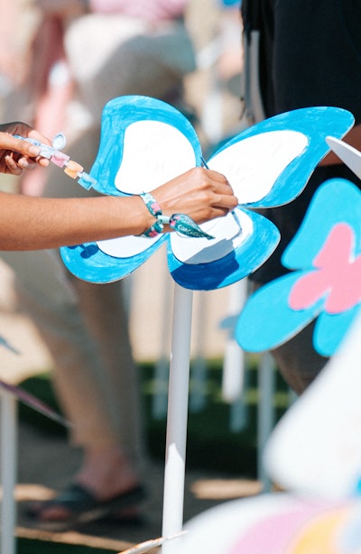 Method also activated at the Coachella campgrounds, most notably with its 'Field of Showers' display. At the start of the festival, the Field of Showers was a blank canvas of plain sculptures of butterflies, flowers, and waves—which attendees could then bring to life with paint. (The shapes of the sculptures represented the designs of the Method scents that festivalgoers could interact with throughout the festival.) There was also a kaleidoscope selfie booth, a three-paned, rotating animated backdrop that offered colorful representations of Method's scents, along with a customization station with iron-on patches. And in a fun touch at the campgrounds, Method curated three playlists that guests could select while taking a shower.