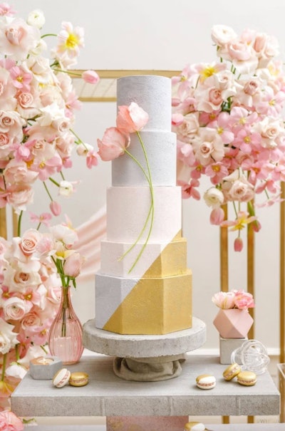 Cakes are a great way to integrate elements of the overall event design, like this flowery option from Vancouver cake studio The Cake & The Giraffe.