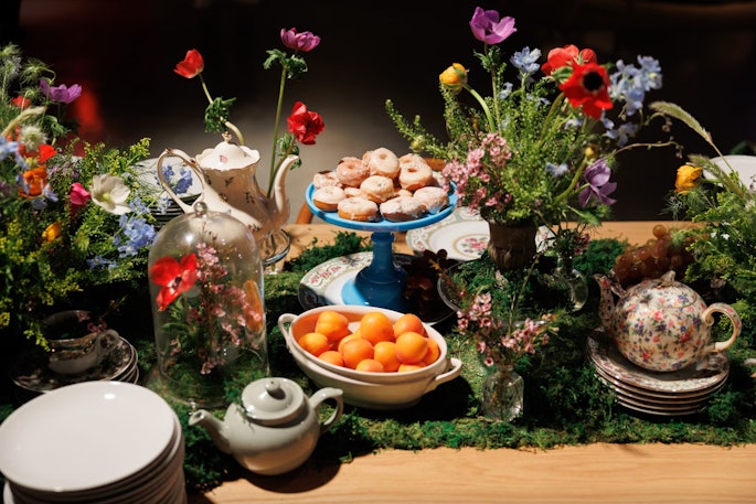 New York-based company Mary Giuliani Catering & Events draws on its founder's theater background to tell stories through food, like with this lush, floral-filled food display that incorporated a pretty spring-inspired tea set.