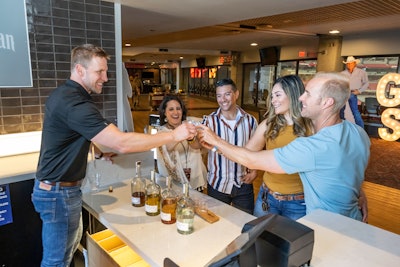 At State Farm Stadium in Glendale, Ariz., guests sample George Strait’s tequila, Código, in the Club Lounge prior to Strait’s concert that evening.