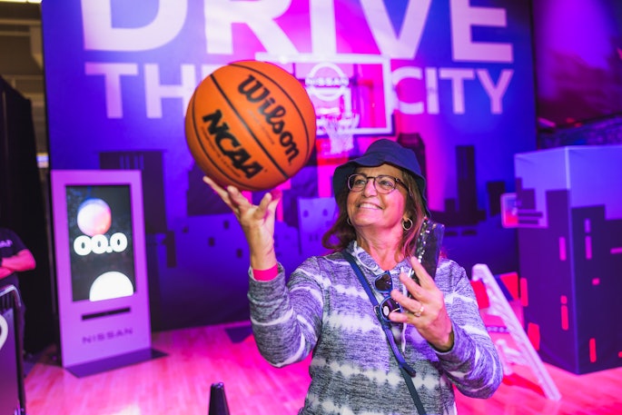 Fans could partake in Drive the City, a dribbling activation that challenged participants to weave through street signs, barricades, buildings, inspirational messages, and the 2024 Nissan Rogue on their way to the basket.