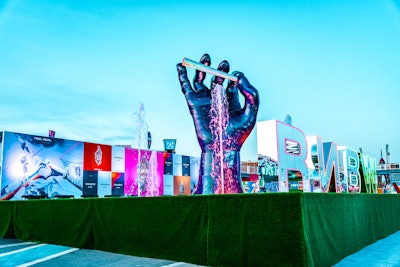 Linares' Canvas Events produced this custom, 30-foot hand sculpture, holding a joint that emitted 'smoke' and was outfitted with LED lights, that was featured at music festivals like Rolling Loud, Hard Summer, and Escape in California.