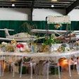 'Tap into travel,' Borunda advises of hosting inside an airplane hangar. 'Hosting an event at a hangar opens doors to many fun themes. Lean into the obvious aviation or travel themes, and decorate with planes and helicopters. Other fun themes can be ‘launch’ parties; milestones ‘reaching new heights’; or anything that can be a fun play on words in relation to planes, helicopters, or the hangar.'
