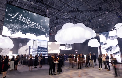 The event space was inspired by NYC above the clouds, as seen through the black-and-white coloring and LED screens displaying the tops of iconic buildings. Signage also displayed “/imagine,” which was meant to be symbolic of an artificial intelligence command to serve as “a metaphor for what we can achieve together,' according to executive producer Lindsay Carroll.