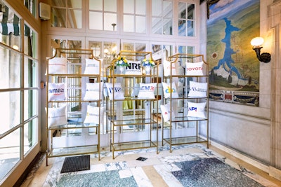 Sponsors, highlighted here with their logos on a branded pillow wall, included Amazon, Delta Air Lines, PhRMA, and the National Retail Federation.