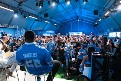 Detroit Lions players and legends appeared on the stage within the space.